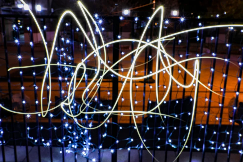 blue lights on a fence with blurry background