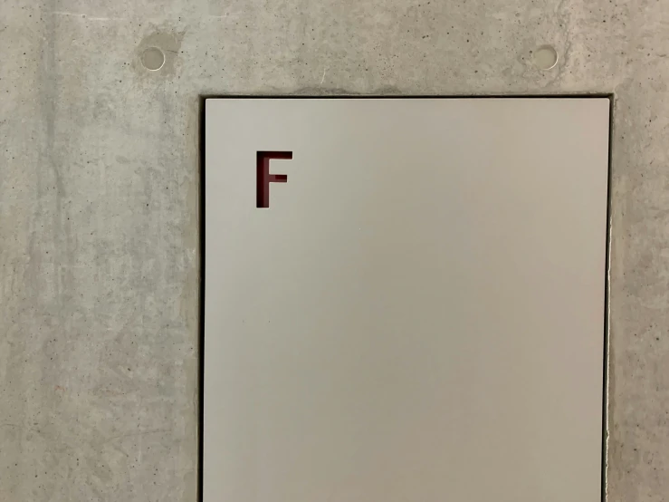a white square with red letter f on it