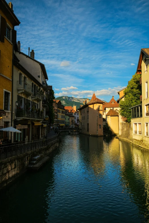 a view of a narrow waterway that's full of houses