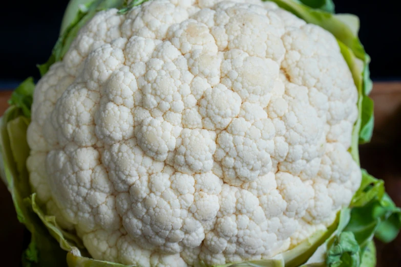 the large white piece of cauliflower is still growing