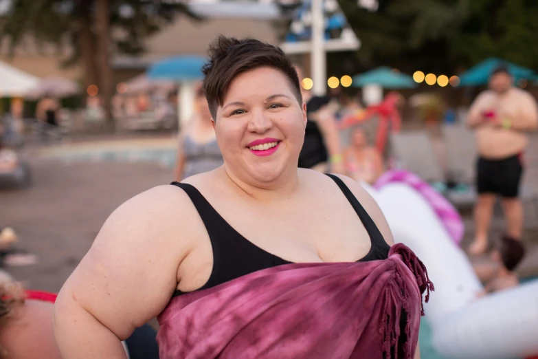 a woman with a very large  in a black top