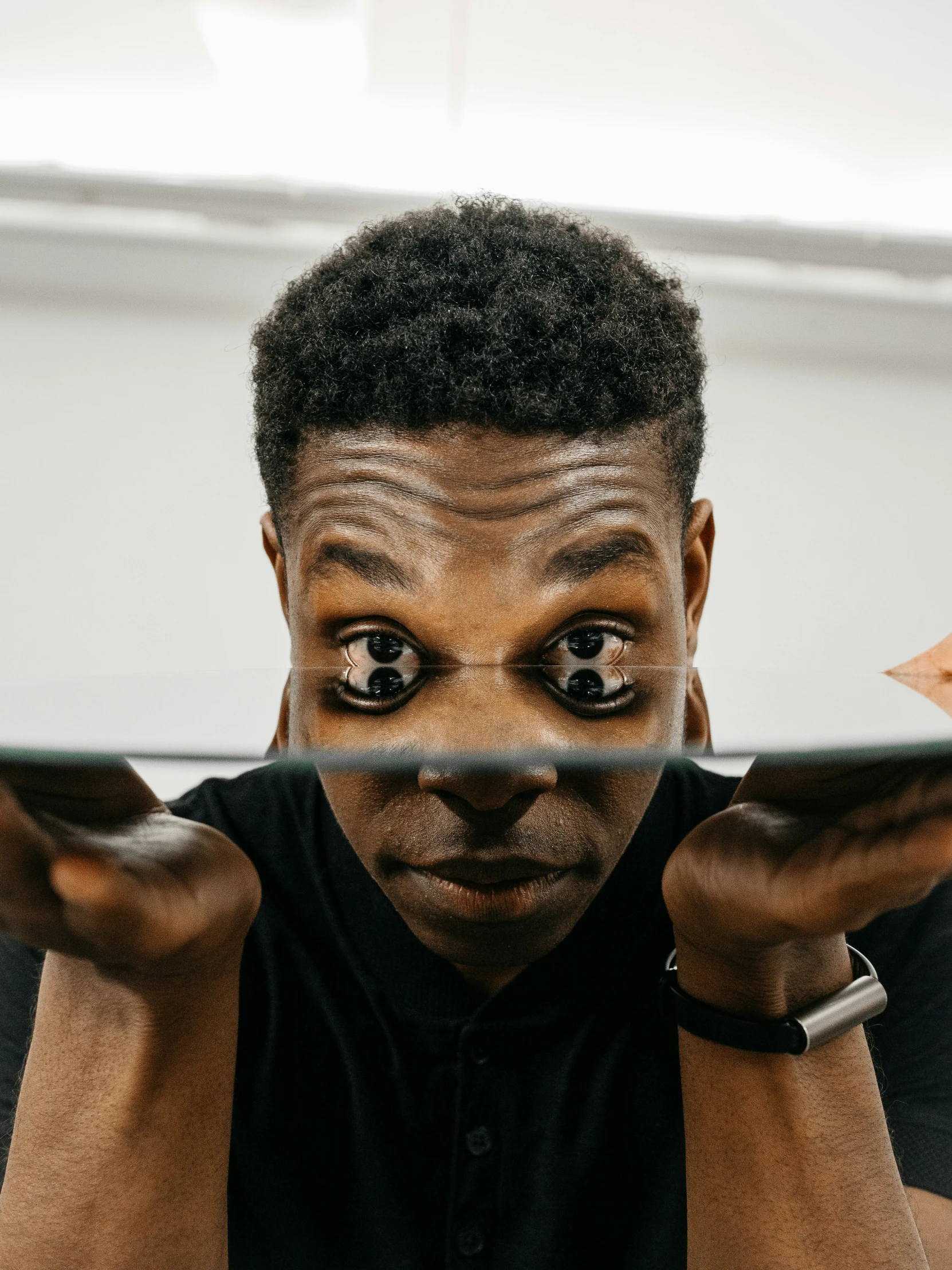 an african american man with glasses and hair