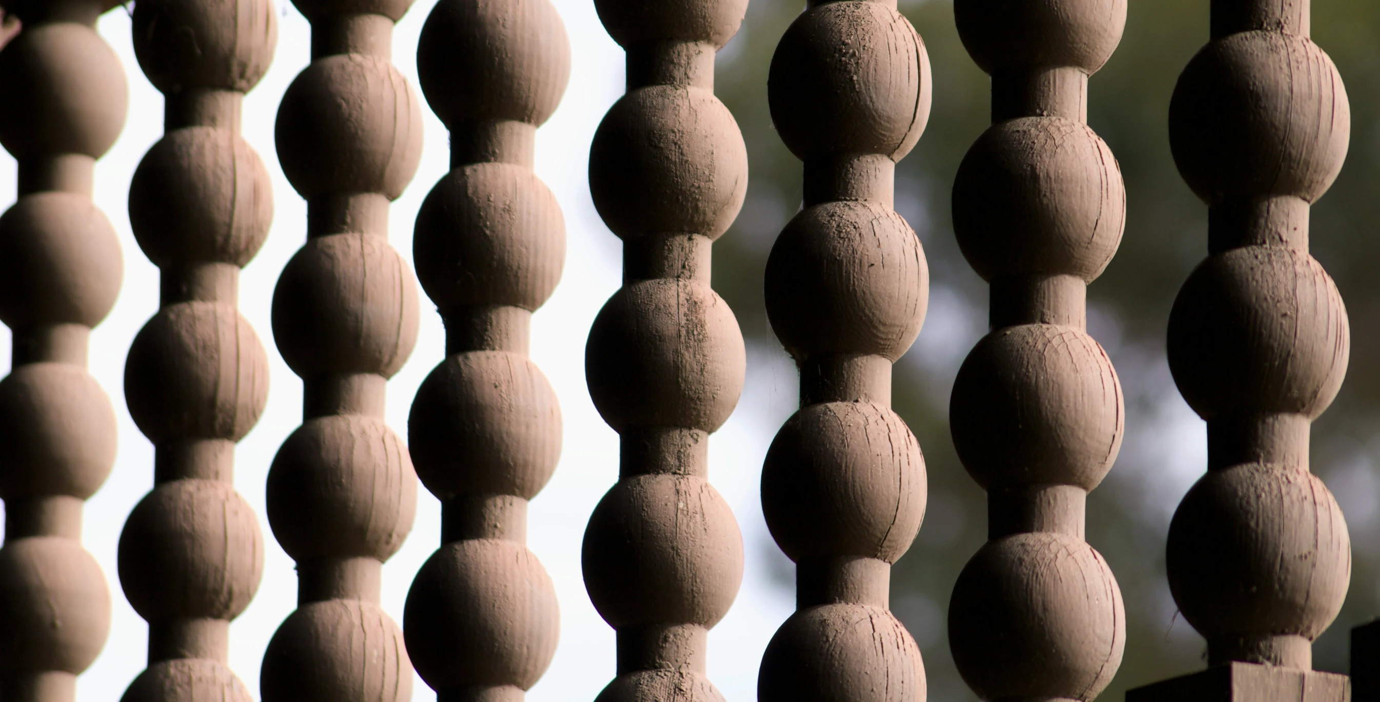 a close up po of a wooden door with a curtain in the background