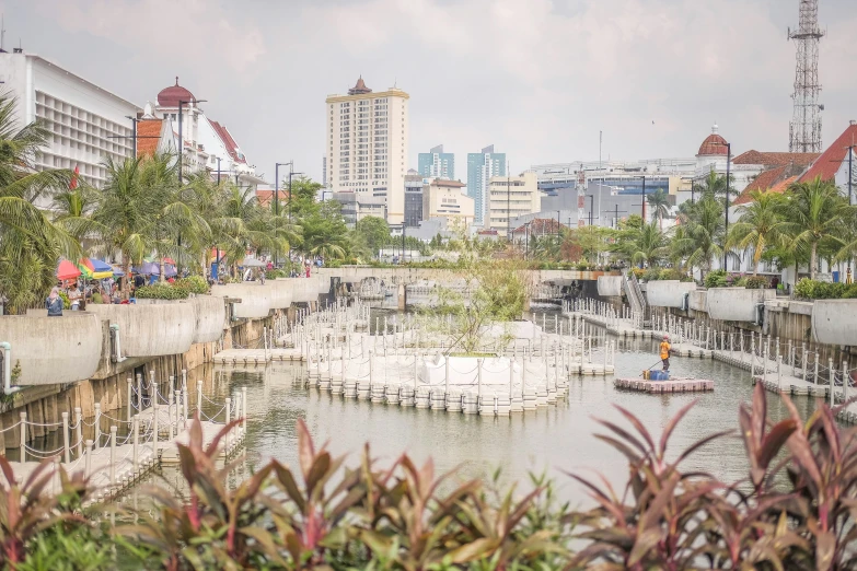 there is a view of city buildings over a pond