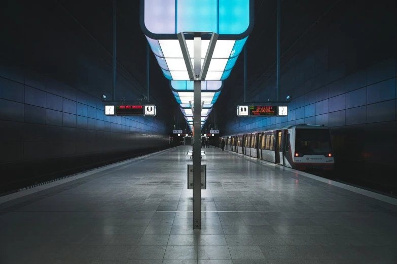 a train traveling through a tunnel next to another