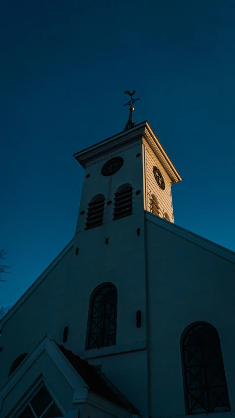 the clock on the steeple of an old building