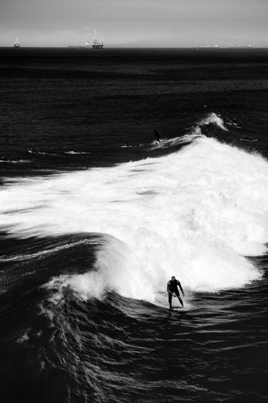 a man that is surfing in some water