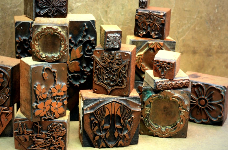 a group of carved wooden boxes sitting on a counter