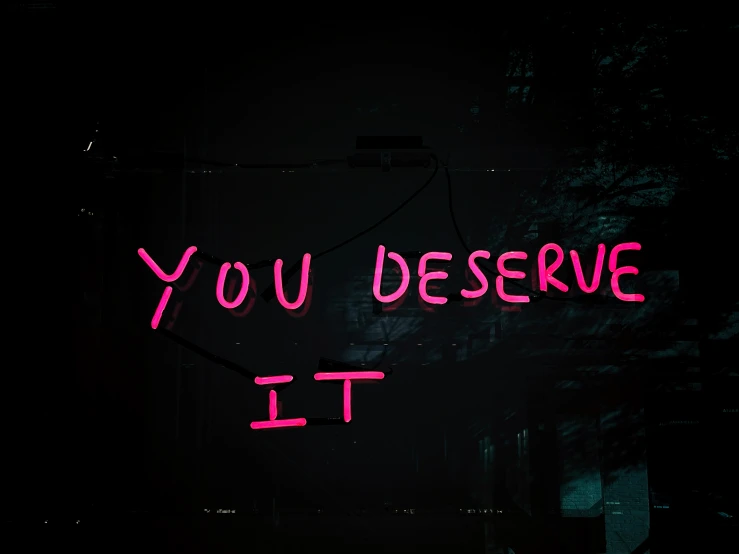 an advertit on a dark background that has red neon letters and neon writing