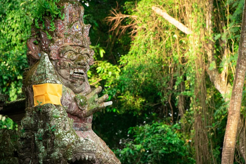 a sculpture of an buddha with its hands in the air