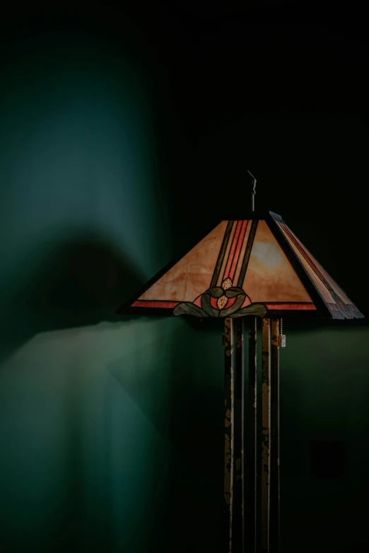 a lamp is shown on a dark background