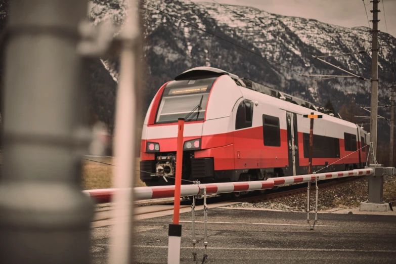 a train traveling past some mountains on its track