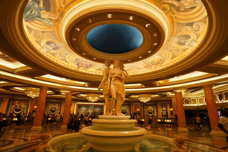 the interior of a huge lobby with decorative designs