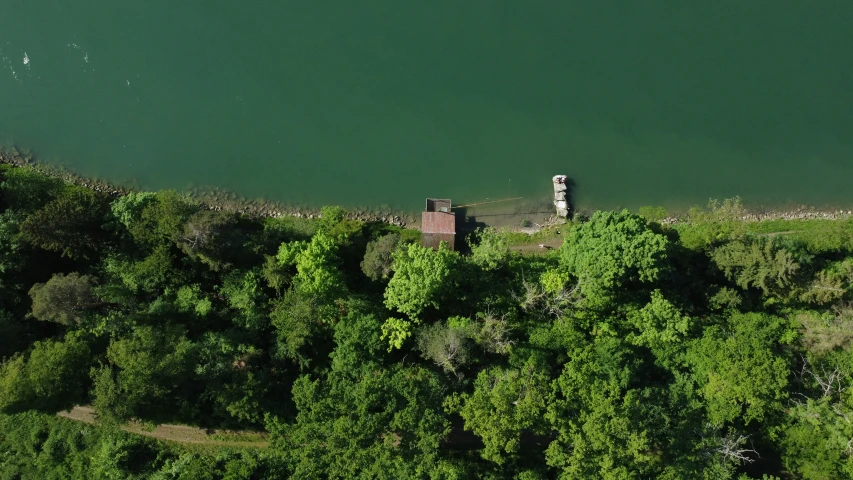 an aerial view of a castle on a hill near the water