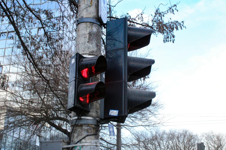 a close up of a street signal with one red light turned on