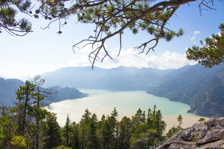 the view over a lake in the mountains