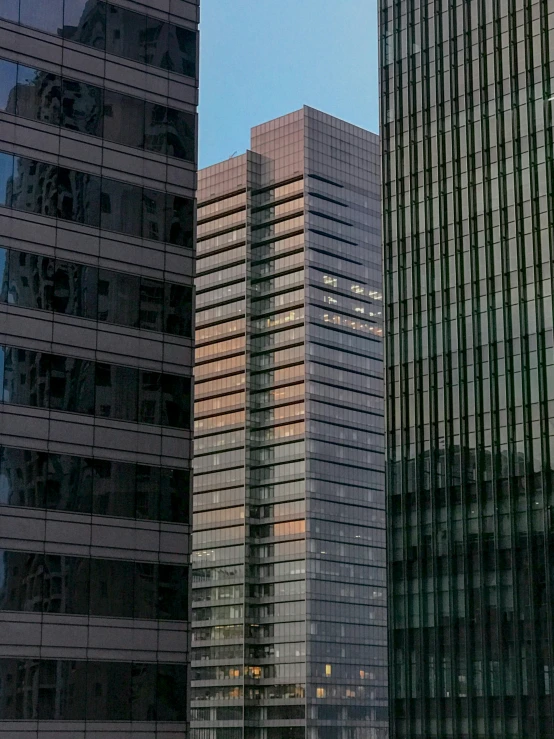 tall buildings in the evening with a traffic light