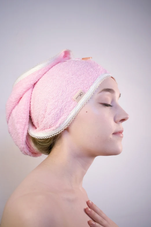 a woman is wearing a towel on her head