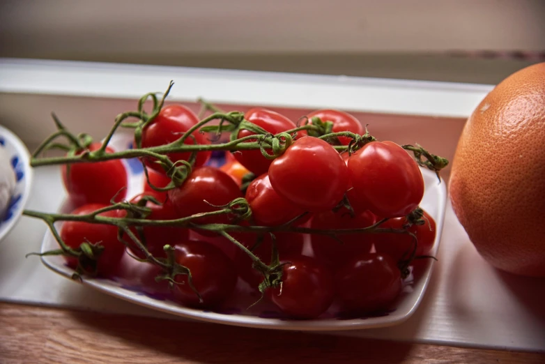 a close up of some tomatoes on a plate