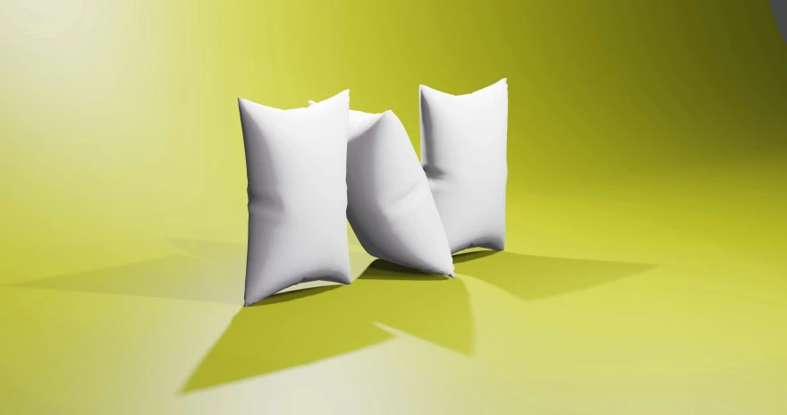 two pillows, one in white and one in black on a yellow background