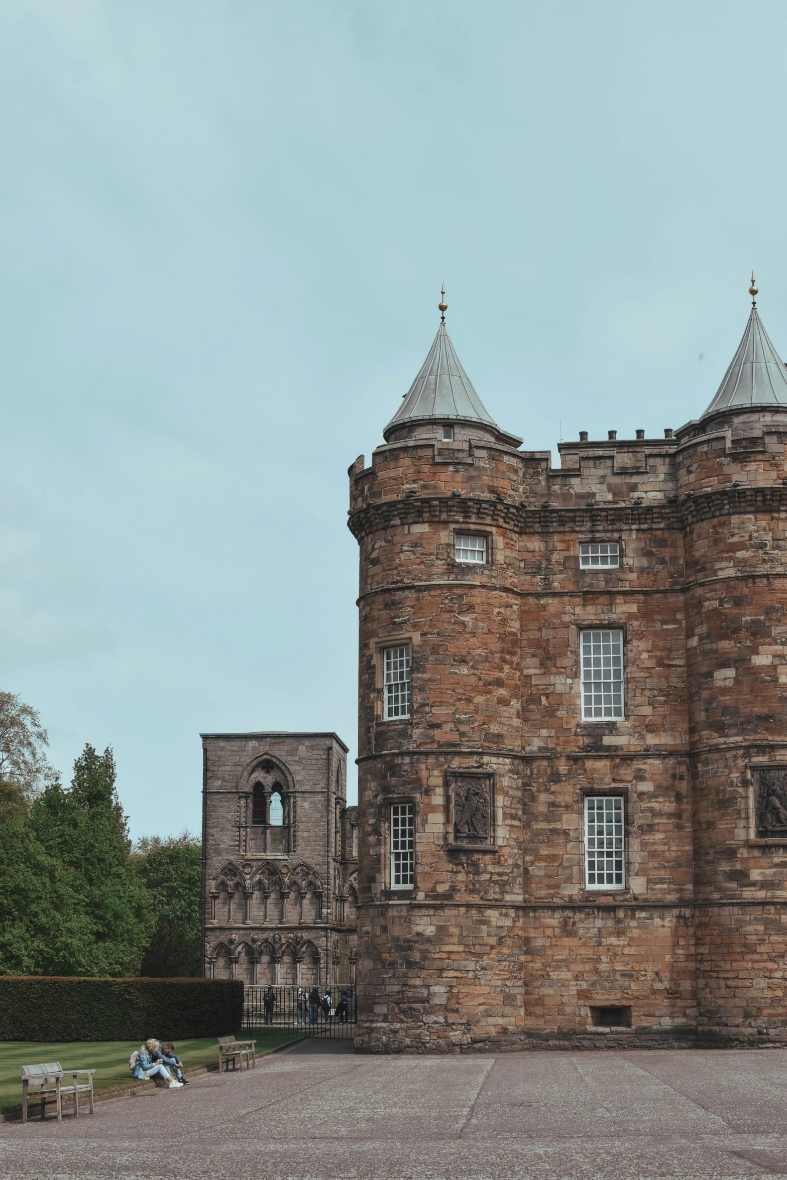 a brick building with two white towers