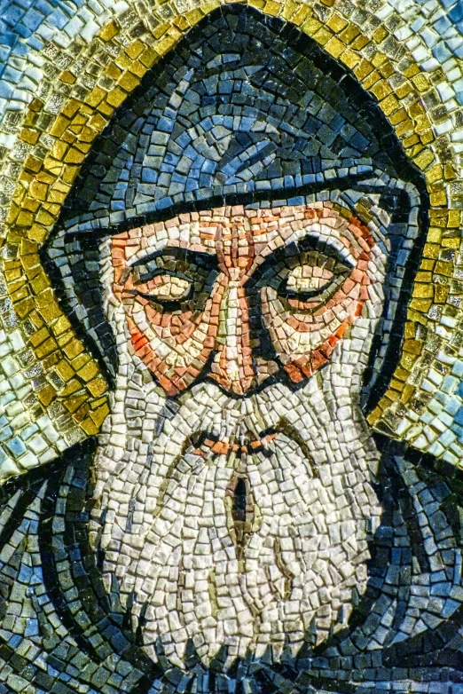 a mosaic image of a man with long beard and wearing a cross