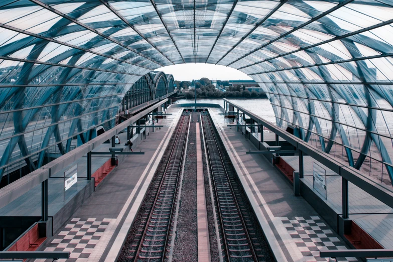 a view looking down at a train under glass