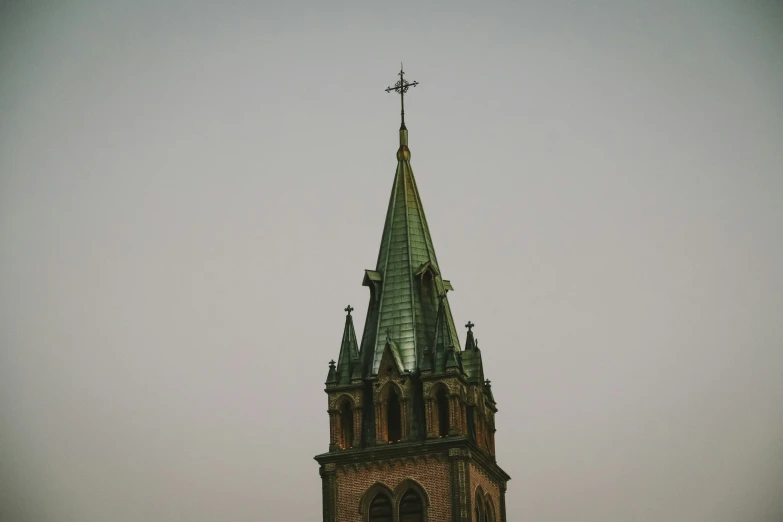 an old church steeple with crosses on top