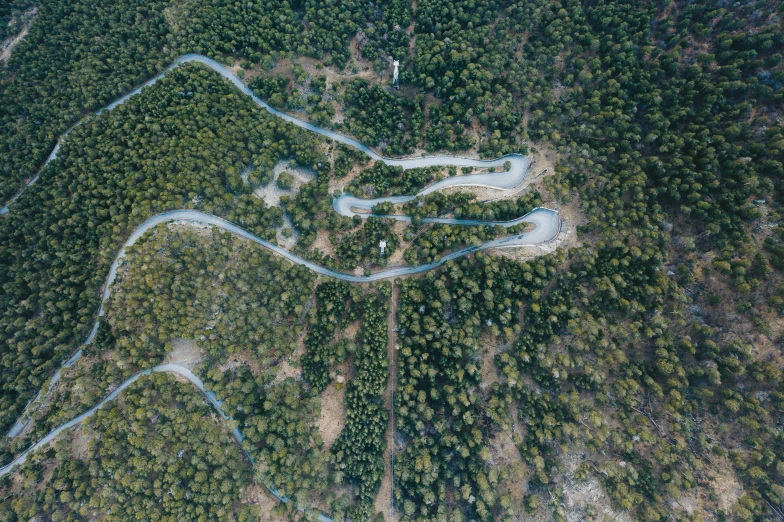 a river crossing into a large wooded area