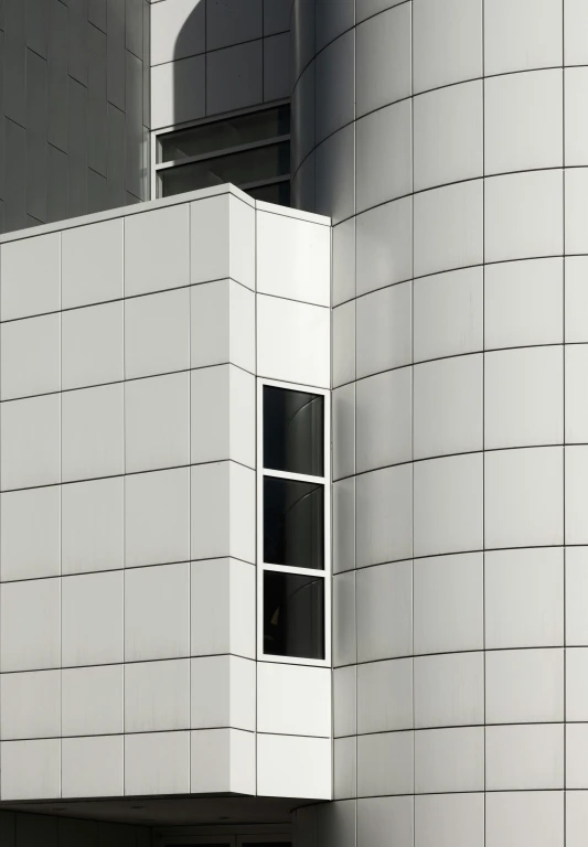 the exterior of a white building with tall windows