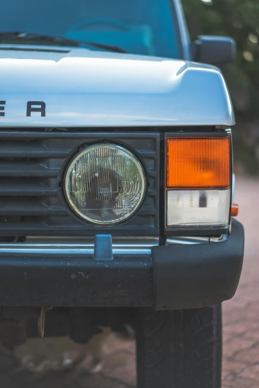 front end of parked truck with headlights visible