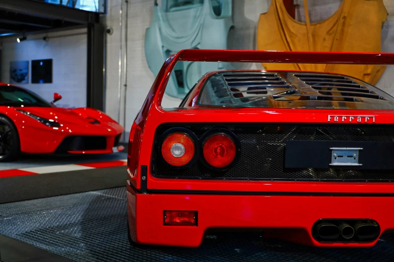 two sports cars are shown parked next to each other