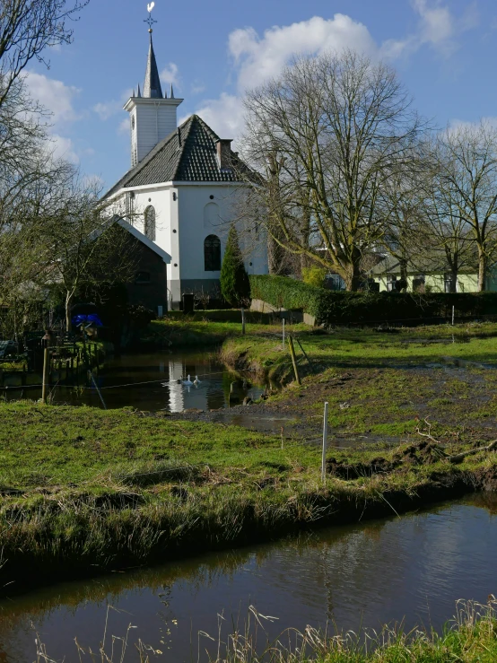 a large white church with a tower and two towers