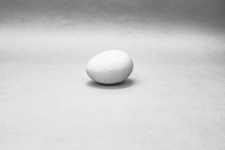 an egg sitting on a gray table