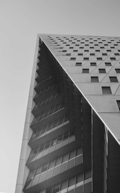 a tall building with lots of windows and metal strips