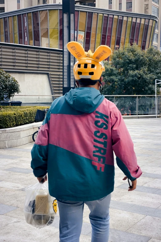 a person with bunny ears on their head and jacket