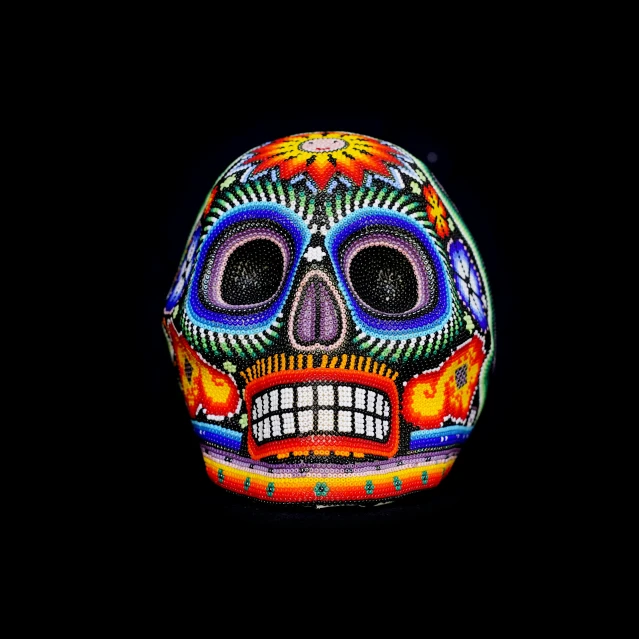 a mexican sugar skull made up in black and red