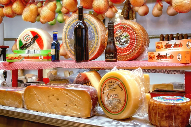 several different types of cheeses are on a counter