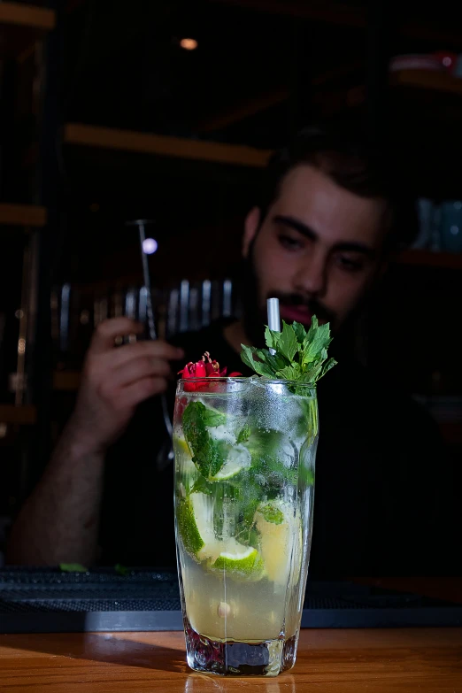 a man and a woman are sitting at a bar