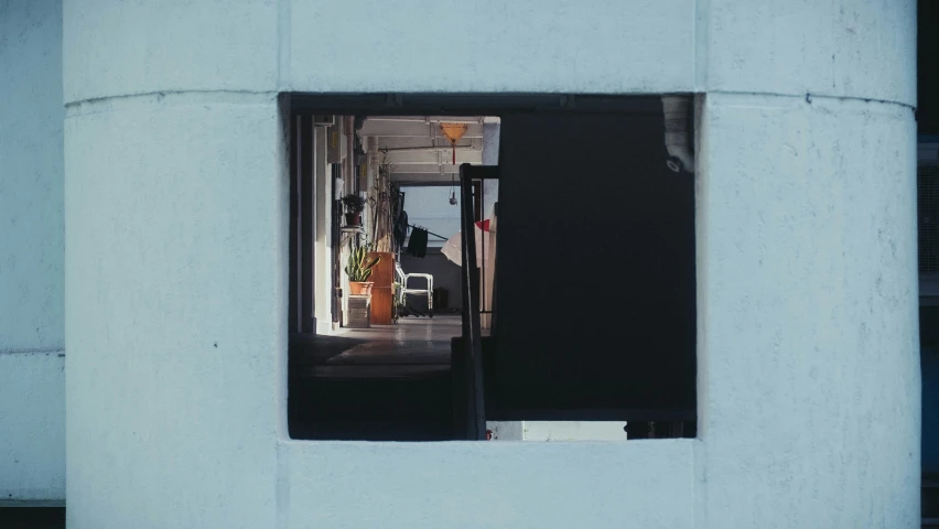 an image of a street seen through a small window