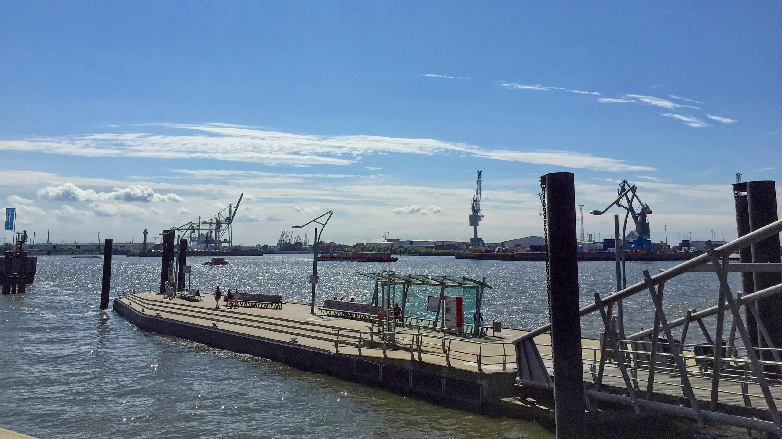 the large boat is parked by the dock