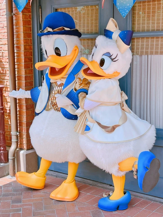two duck costumes standing next to each other
