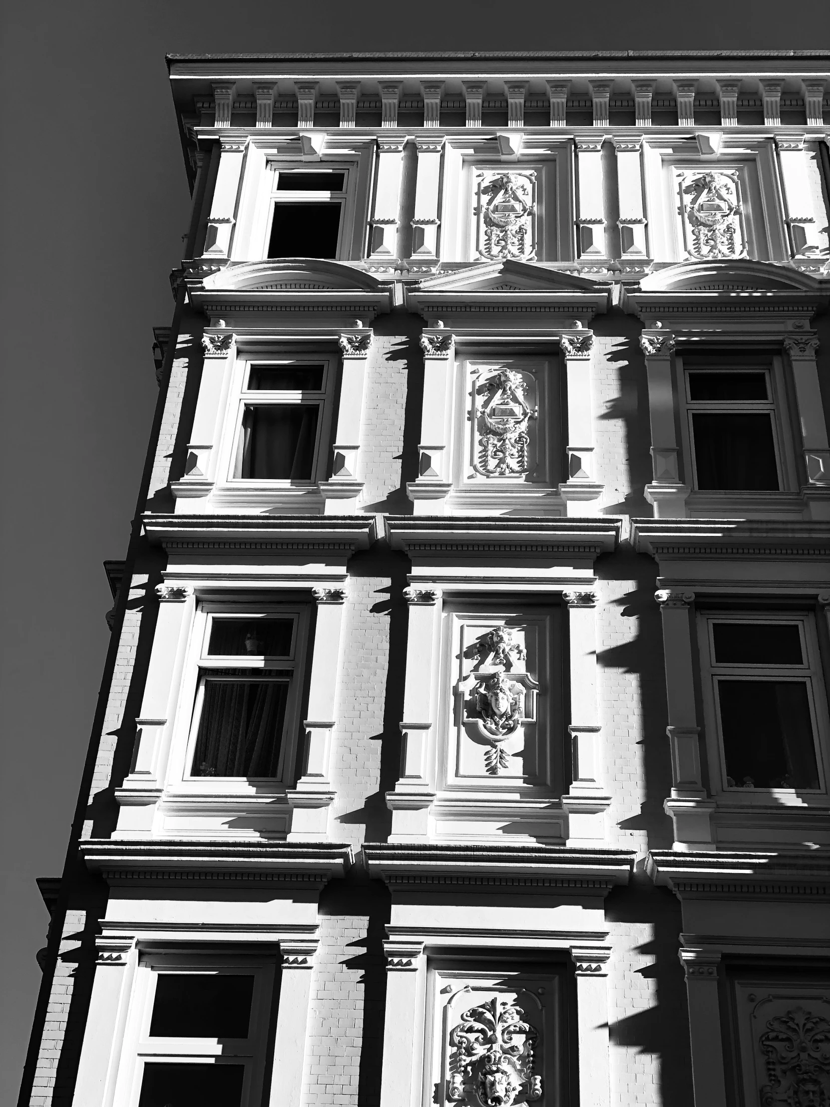 a black and white po shows the top of an old building