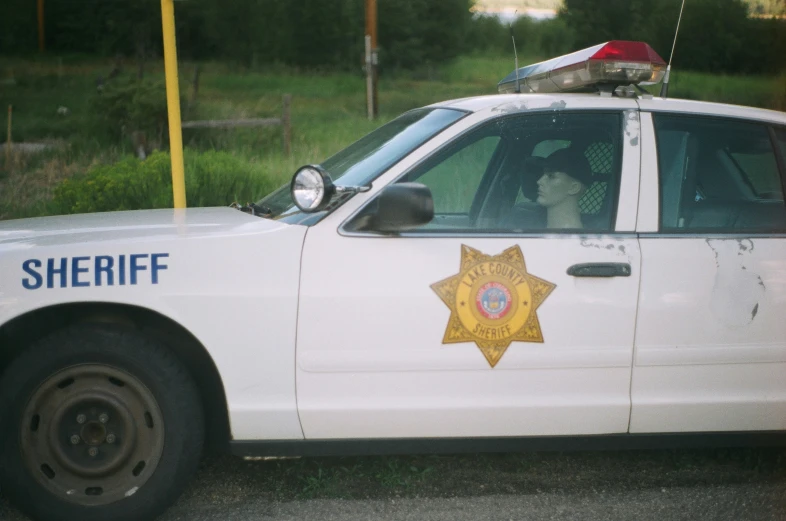 a sheriff car sitting on a street side