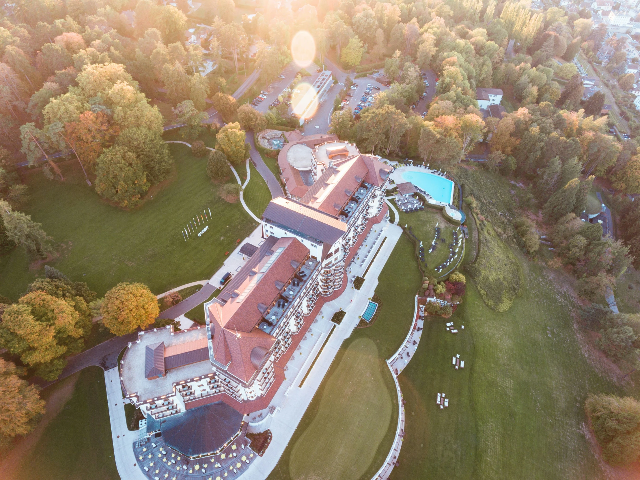 an aerial view of a large, stone and stucco mansion