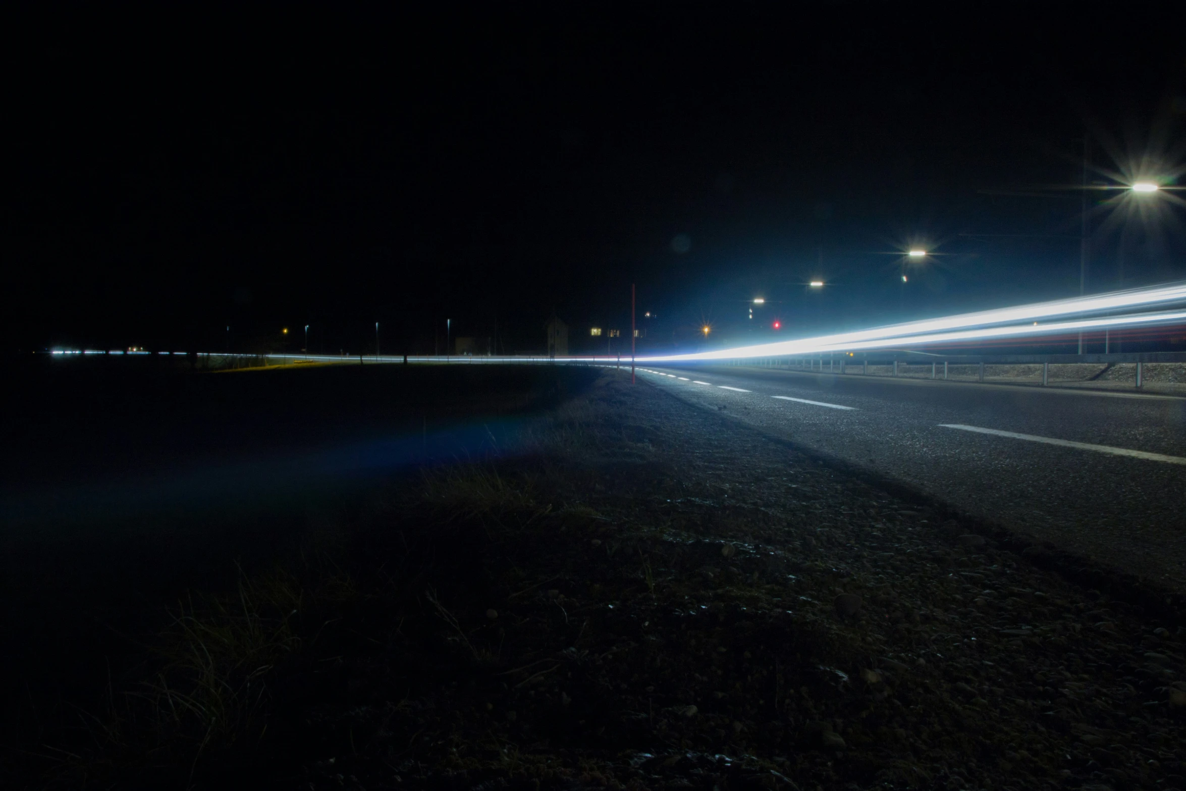 a long exposure s of headlights on a road