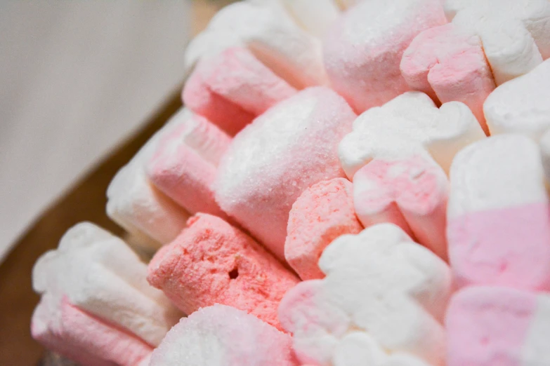 close up view of pink and white marshmallows