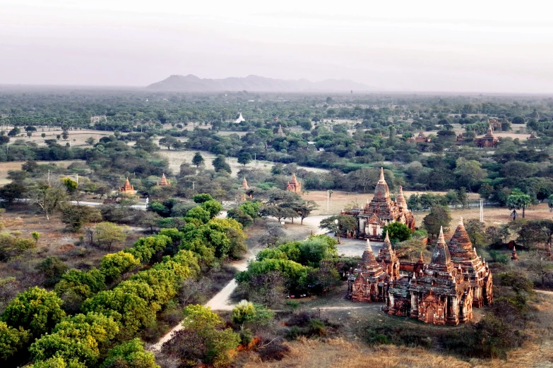 an aerial view of a very old structure and trees