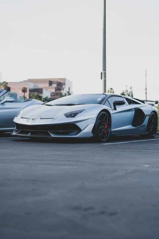 two cars on a race track next to each other