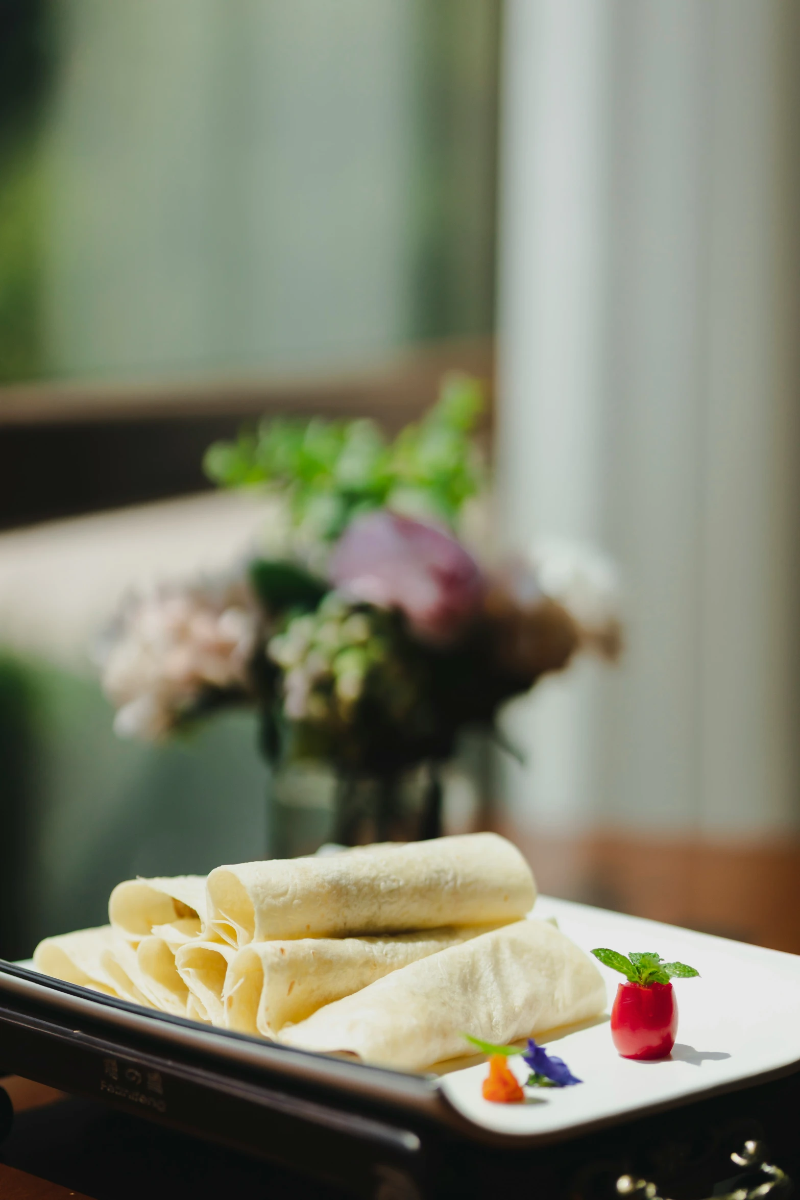 two tortillas on a plate and some garnish